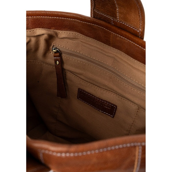 Redesigned Project 81 Torn and Cut Bag - Walnut. Close-up of a brown leather bag with stitching detail