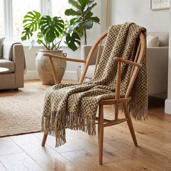 Penarth Welsh blanket. Draped over a wooden chair in a modern living room