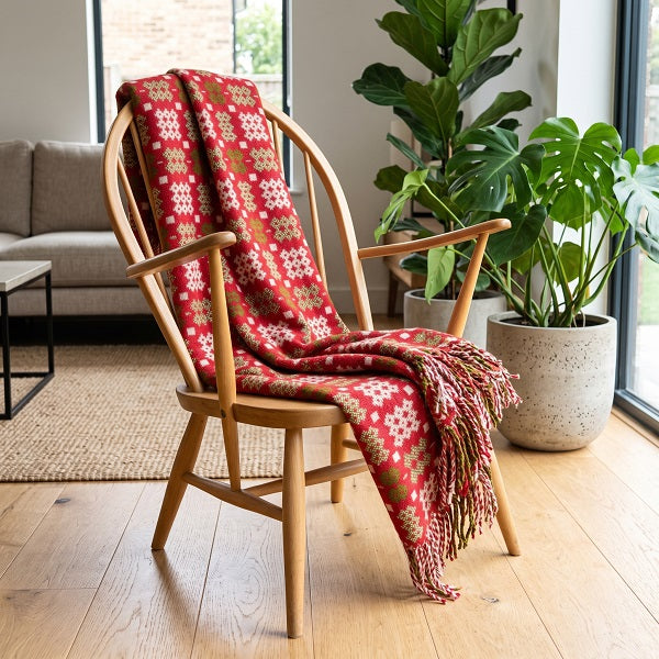 Preseli Welsh blanket. Draped over a wooden chair in a modern living room