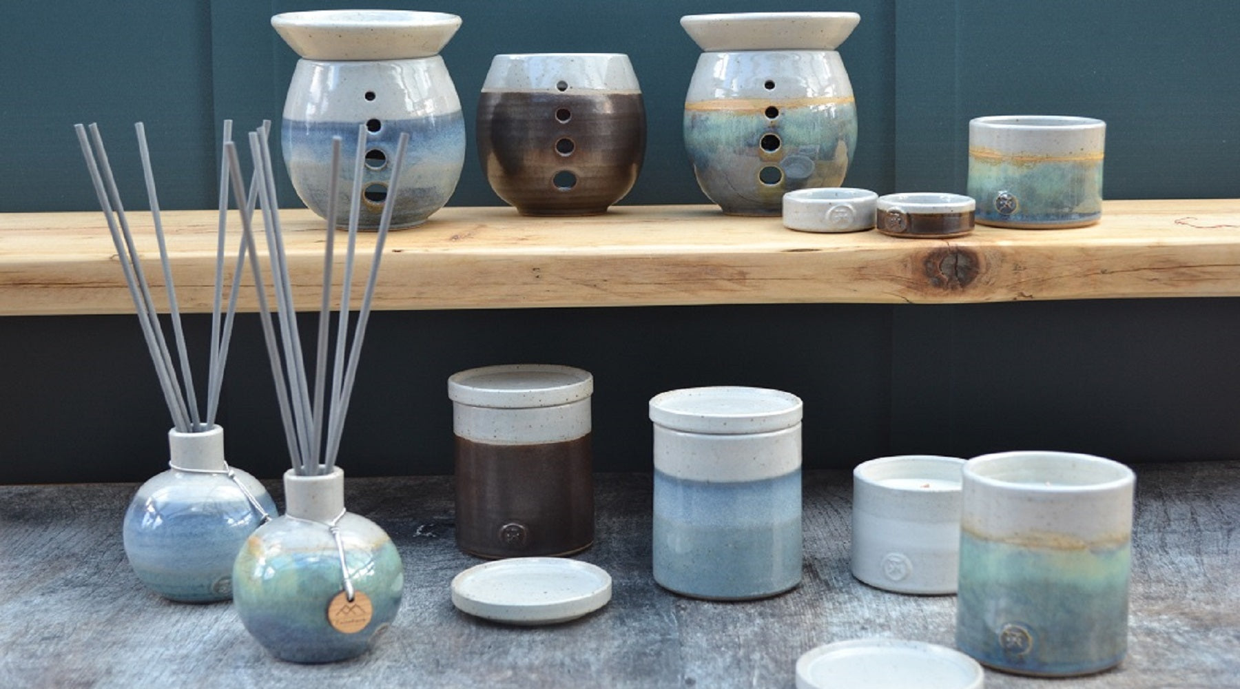  Hand poured candles and diffusers in Stoneware pottery. Candle accessories, wax melt burners, snuffers and wick trimmers