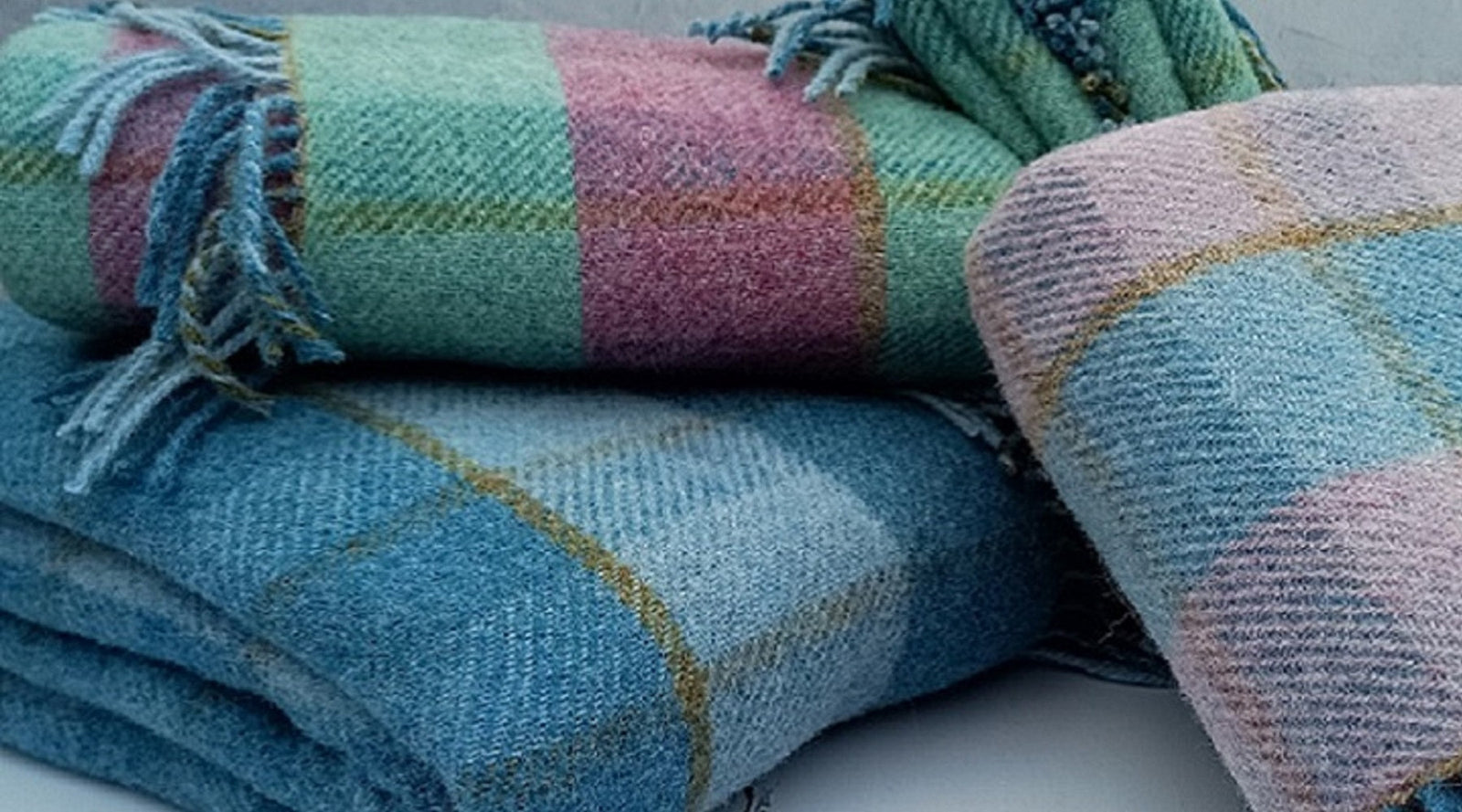 Wool throws, soft as a cloud to touch, cosy and warm