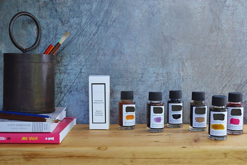 Paint and Scribe. Row of small ink bottles with labels 