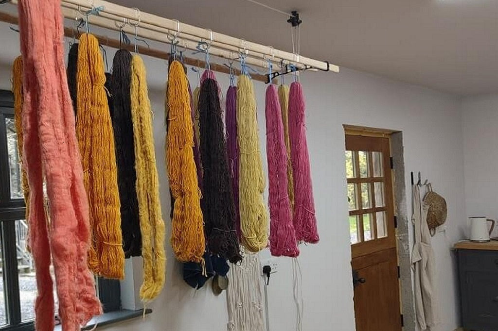 Cardiff Workshops - Hand dyed yarn hanging on a Sheila maid rack