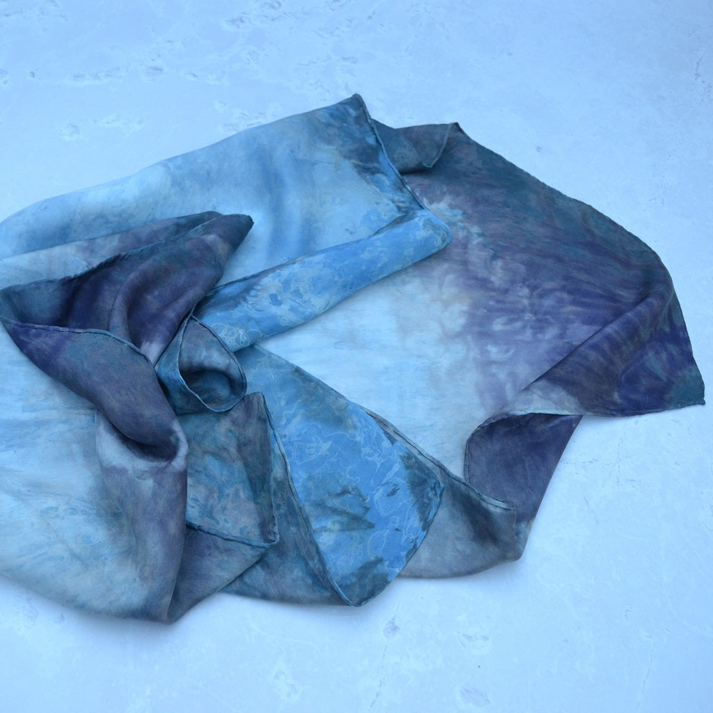 A beautiful silk scarf hand dyed in a resist using a variety of natural dyes. The result is a soft flow of colour and resist patterns throughout the piece 3