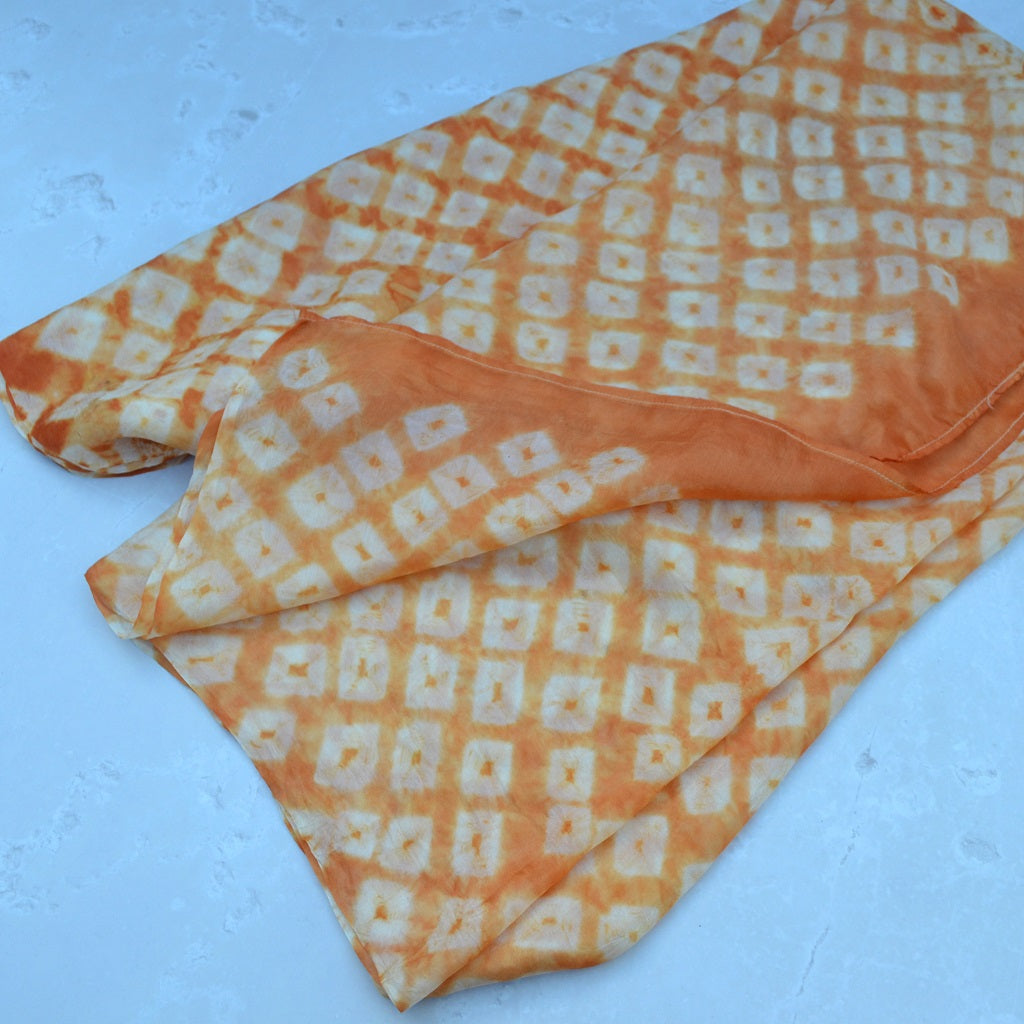 Hand dyed scarves, dyed with natural dyes. A silk shawl in a dot design that has been hand-tied by skilled Bandhani artisans of India 3