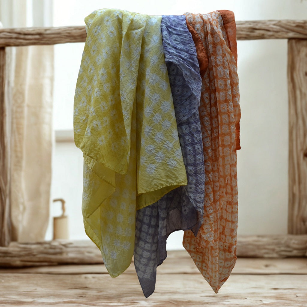 Hand dyed scarves, dyed with natural dyes. A silk shawl in a dot design that has been hand-tied by skilled Bandhani artisans of India 1