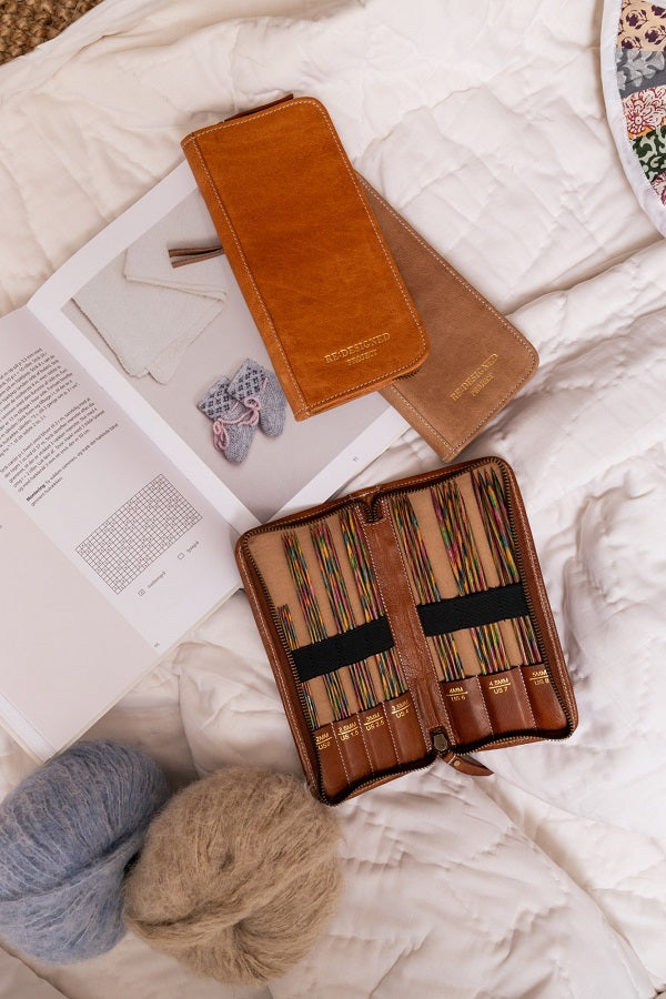 Redesigned project 102 premium leather  needle case - group of different colour cases