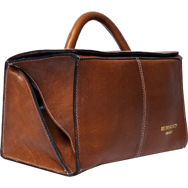 Project 134, a handcrafted leather knitting accessory bag designed to keep your yarn and tools neatly organised in style, at home or on the go. Walnut