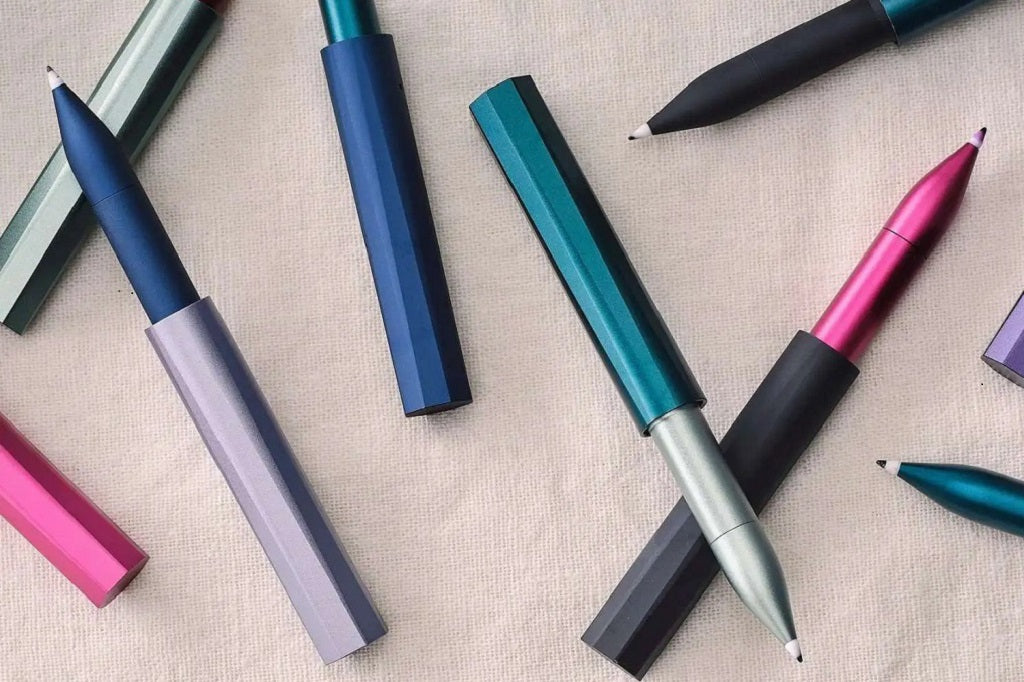Tom's Studio, the Brand - Colourful pens on a textured surface
