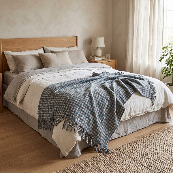 Ramsey Welsh blanket. Draped over a double bed in a modern bedroom.