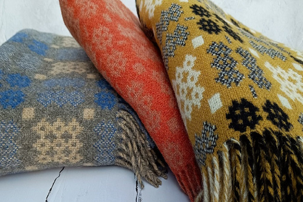 Welsh blankets in a spectrum of colours - green welsh blankets, red, blue, grey, pink and more...
