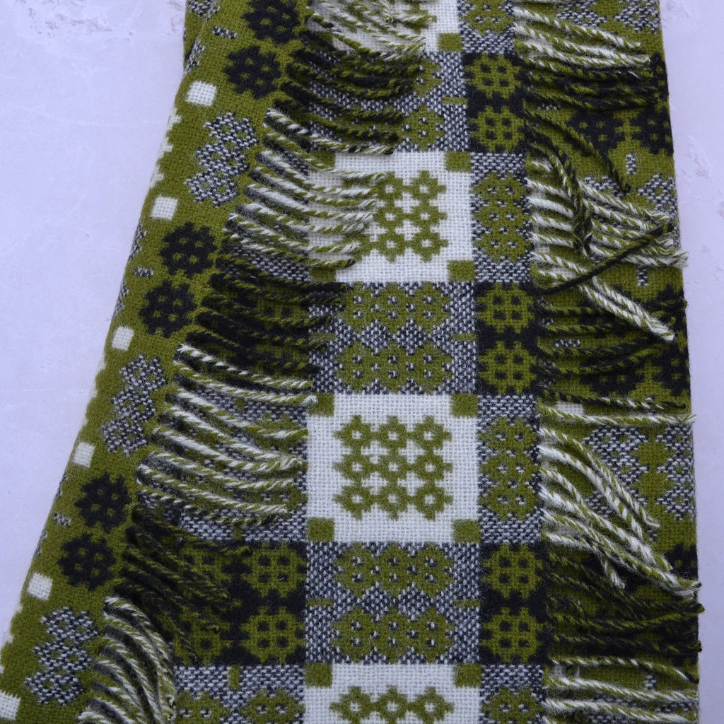 TirGlas Welsh blanket, Cwm Elan. A traditional Welsh blanket, woven in  the  Caernarfon portcullis design. Moss Green weft and a cream and black warp.