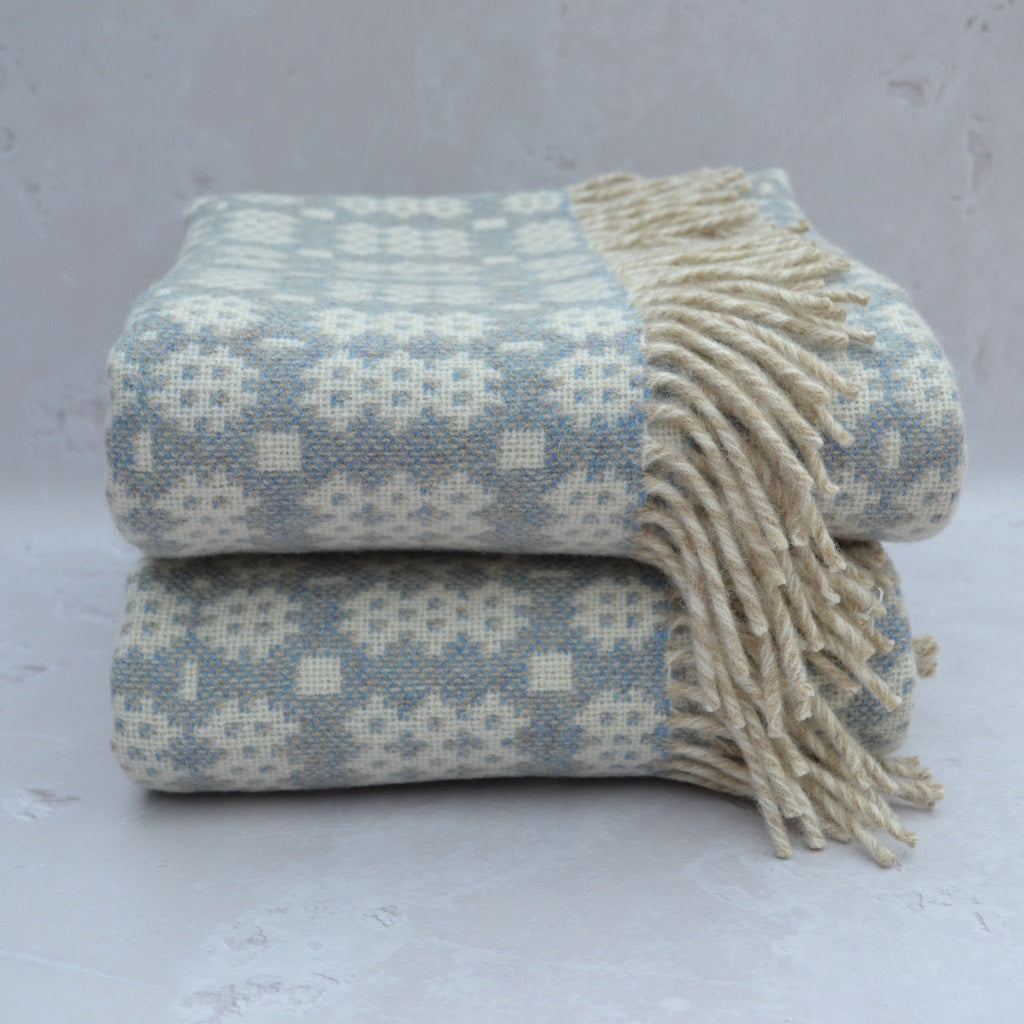 TirGlas Welsh blanket - Maldwyn. This tapestry style blanket is the perfect blend of tradition, quality, and modern style for any room in your home. Its double cloth weave makes it fully reversible.