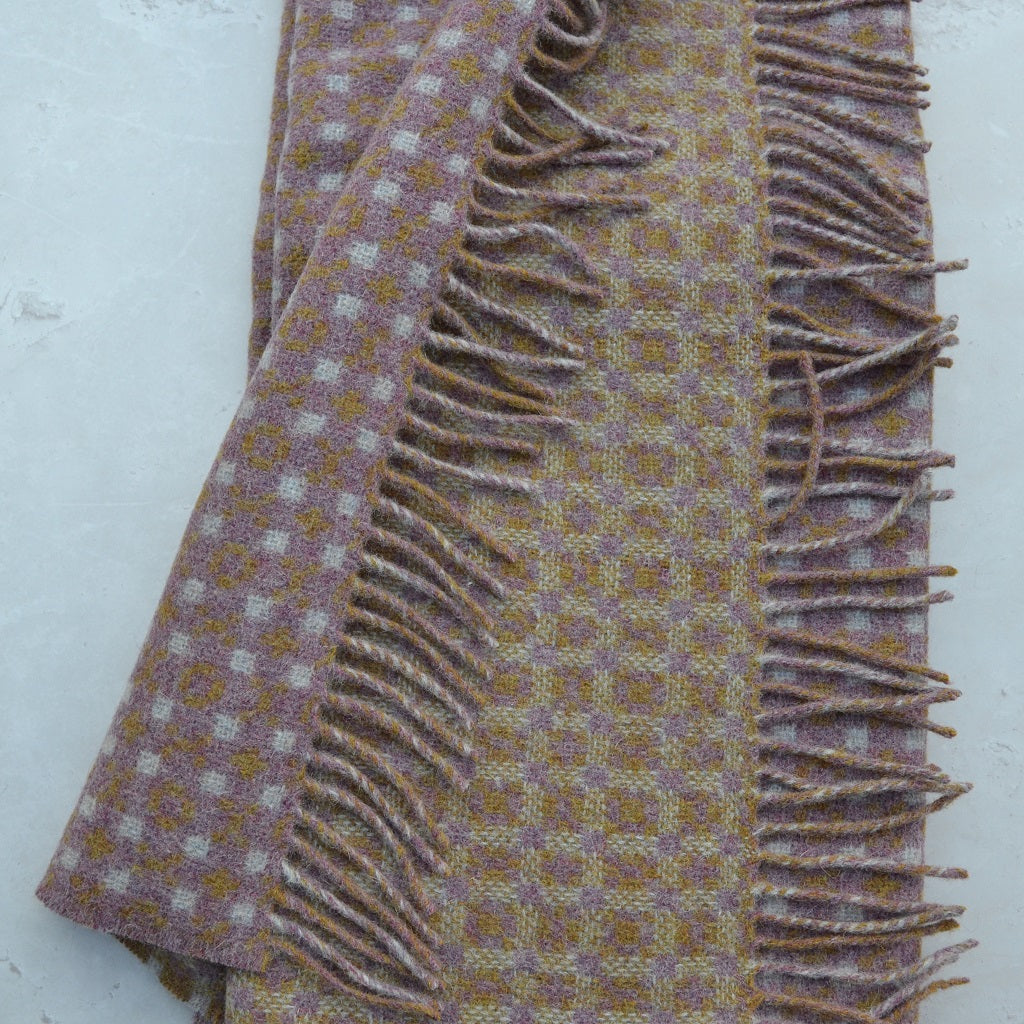 TirGlas Welsh blankets - Menai, woven in a mauvelous pink with cream and amber spot patterns