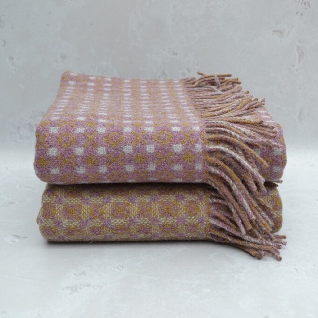 TirGlas Welsh blankets - Menai, woven in a mauvelous pink with cream and amber spot patterns.