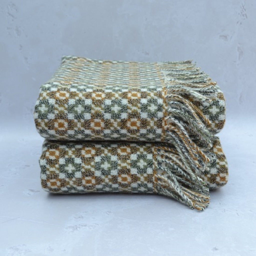 TirGlas Welsh Blankets - Penarth  A soft and warm traditional double cloth reversible blanket. Woven in Gold, Sage and Charcoal on an Almond background.