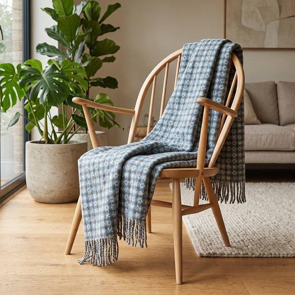 Ramsey Welsh blanket. Draped over a wooden chair in a modern living room