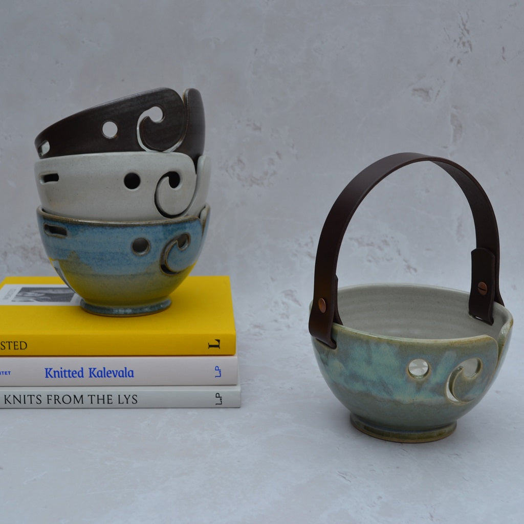 Unique round-based yarn bowls with our distinctive and much-loved leather handles are available in our Stoneware Pottery range. Sea Green.