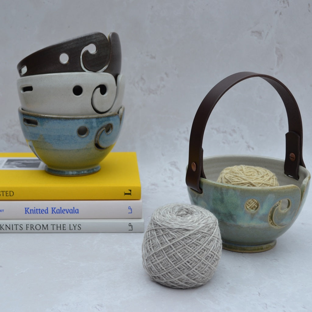 Unique round-based yarn bowls with our distinctive and much-loved leather handles are available in our Stoneware Pottery range. Sea Green.