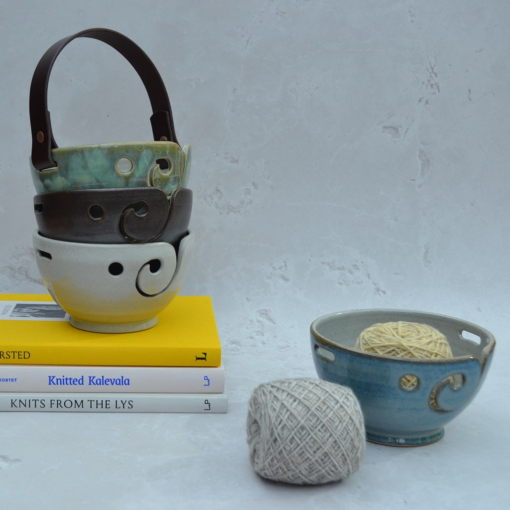 Unique round-based yarn bowls with our distinctive and much-loved leather handles are available in our Stoneware Pottery range. Sky Blue.