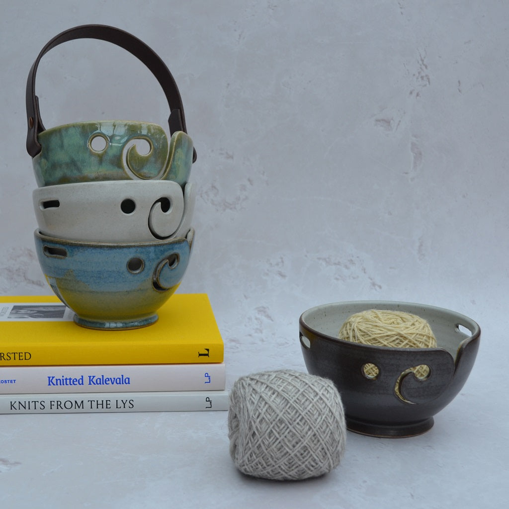 Unique round-based yarn bowls with our distinctive and much-loved leather handles are available in our Stoneware Pottery range. Walnut.