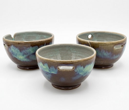 Sea Green. Three ceramic bowls with handles on a white background